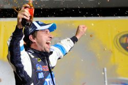 David Reutimann celebrates in Chicagoland Speedway’s Victory Lane after getting his second series win – first was the rain-shortened win at Charlotte Motor Speedway. Credit: John Harrelson/Getty Images for NASCAR